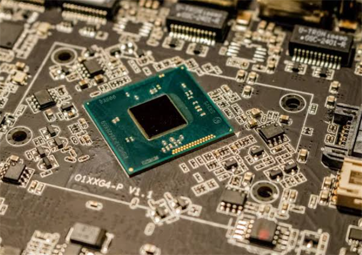 Central memory chip mounted on a complex circuit board, representing chip packaging and testing operations based in Penang Malaysia