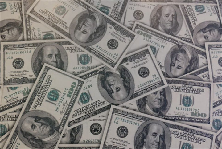 Stacked hundred-dollar US banknotes representing the long-standing US dollar reserve currency system