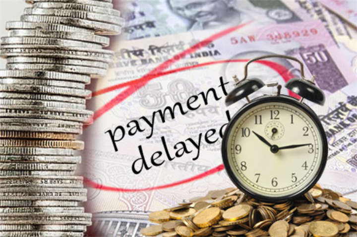 Alarm clock, stacks of coins and Indian rupee banknotes marked 'payment delayed', visualizing late payment fraud schemes