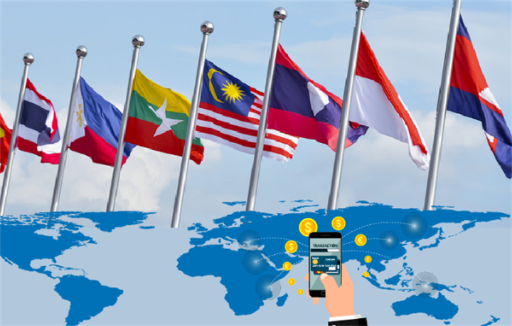 ASEAN national flags over a world map, representing cross-border interoperable payment systems in Southeast Asia